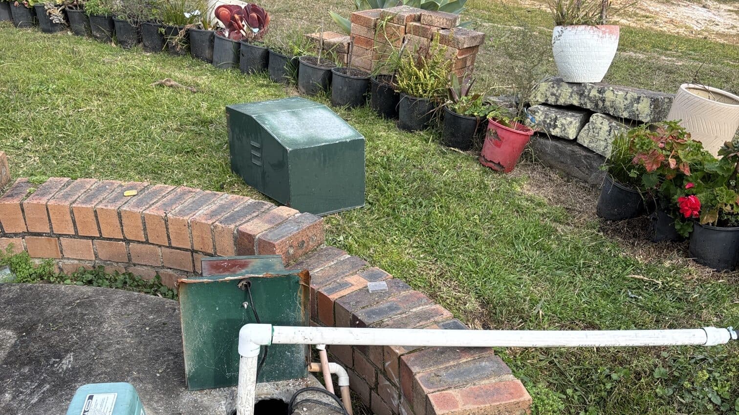 An open septic treatment system with its pump housings on an acreage block